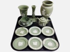 Twelve pieces of Wedgwood green Jasperware including pin dishes, vase, candlestick, etc.