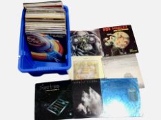 A box of vinyl LP records including Genesis, Jethro Tull, Bob Marley, Santana,