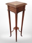 A reproduction mahogany plant stand,