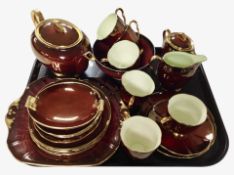 23 pieces of Carlton Ware Rouge Royale tea china, and a similar Royal Winton Rouge dish.