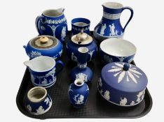 Eleven pieces of Wedgwood blue Jasperware including jugs, bowls, squat vases, etc.