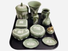 Eleven pieces of Wedgwood green Jasperware including trinket boxes, vase, table lighter, etc.