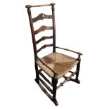 A 19th century oak rattan farmhouse rocking chair