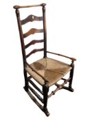 A 19th century oak rattan farmhouse rocking chair