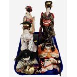 A group of contemporary geisha figures.