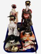 A group of contemporary geisha figures.