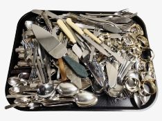 A quantity of stainless steel cutlery, napkin rings, etc.
