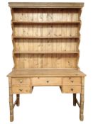 An early 20th century pine farmhouse kitchen dresser,