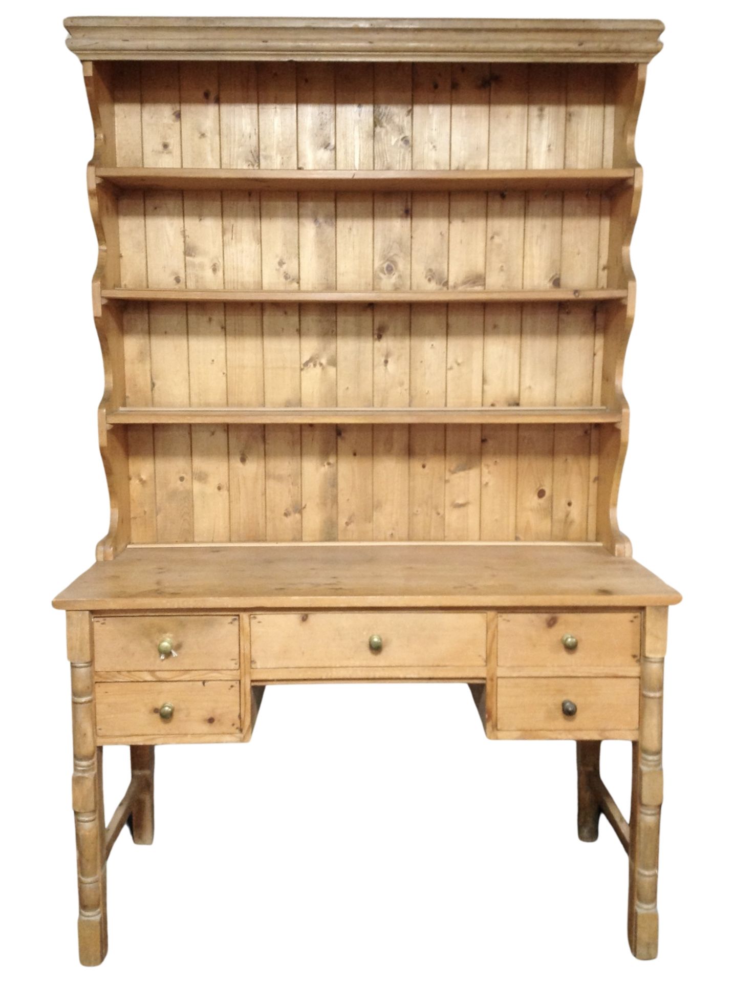 An early 20th century pine farmhouse kitchen dresser,