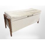 A 20th century upholstered teak storage ottoman,