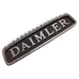 A die cast metal Daimler badge,
