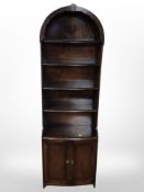 An Ercol stained elm open bookcase,