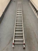 An aluminium sixteen tread two section extension ladder