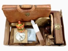 A box containing vintage leather satchel barometers, rule,