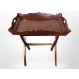 A reproduction mahogany butler's tray on stand,