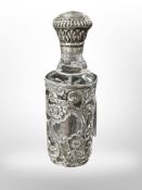 A silver-mounted glass bottle, height 13cm.
