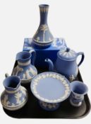Six pieces of Wedgwood blue Jasperware including boxed vase, teapot, pedestal bowl, etc.