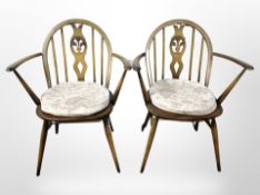 A pair of Ercol Windsor style dining chairs