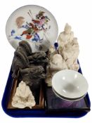 A group of oriental resin figures, porcelain plate depicting a samurai, rice bowls, etc.