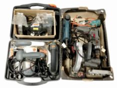 A box and plastic tool case containing assorted power tools.