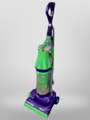 A Dyson upright vacuum cleaner.