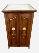 A mahogany double door cabinet with plate glass top,