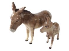 A Beswick donkey and foal, tallest 13.5cm.