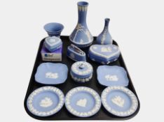 Twelve pieces of Wedgwood blue Jasperware including vases, heart-shaped trinket boxes, pin dishes,