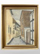 C Skousgaard : A cobbled street through a town, oil on canvas, 32cm x 39cm.