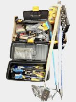 A quantity of unused tools and hardware including drill bit sets, hand tools, rules, etc.