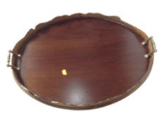 A reproduction mahogany twin handled serving tray,