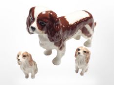 A group of three Beswick spaniels, tallest 13cm.
