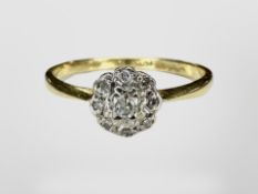 An 18ct gold diamond cluster ring. CONDITION REPORT: 2.1g.