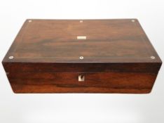 A Victorian rosewood and mother of pearl-inlaid writing slope.