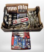 A box of a large quantity of cutlery, some boxed, collector's spoons, etc.