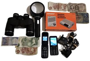 A collection of mobile phones, binoculars, world coins, etc.