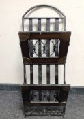 A wrought metal magazine rack