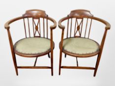 A pair of late Victorian mahogany and satinwood inlaid elbow chairs