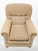 A contemporary wingback armchair