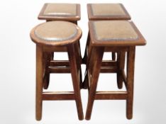 A set of three oak bar stools with studded leather seats together with a similar stool