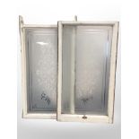 Two antique etched windows in painted frames, 104cm x 59cm.