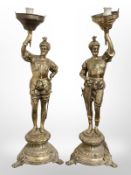 A pair of cast brass figural table lamps,