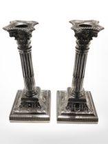 A pair of Victorian loaded silver Corinithian column candlesticks with removable sconces,