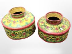 Two graduated Indian hand-painted metal pots, largest 26cm high.