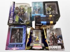 A group of boxed action figures including Lucy Westenra, Black Panther bobble heads,