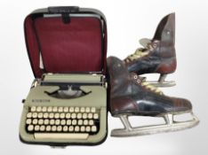 A pair of vintage leather ice skates and an Impex Maria typewriter.