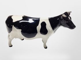 A Beswick C H Claybury Leegwater Friesian cow, height 12cm.