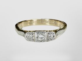 A 9ct gold three-stone dress ring. CONDITION REPORT: 2.7g.