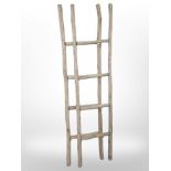 A pair of rustic wooden ladders.