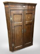 A 19th century inlaid oak corner cabinet,